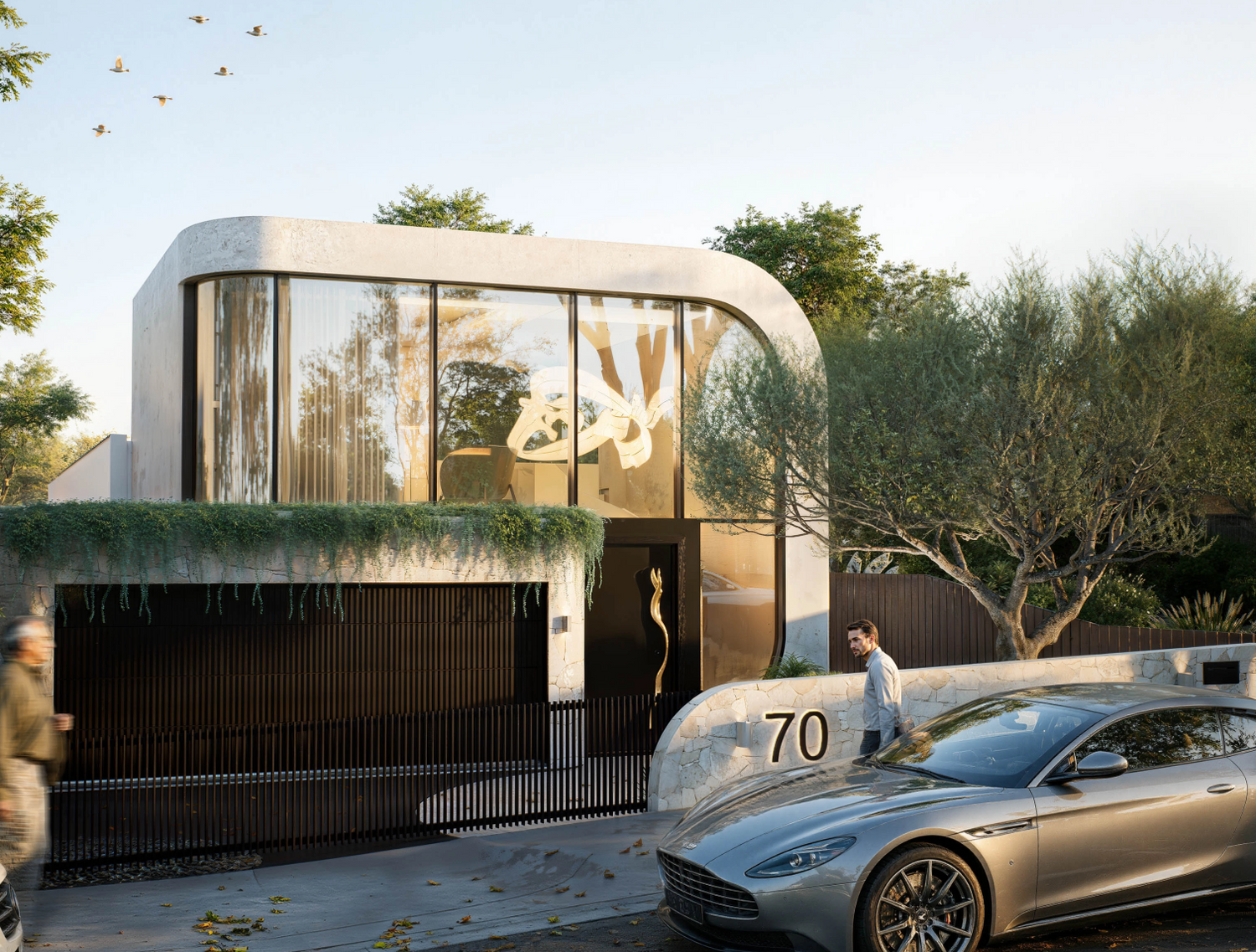 Luxury modern home facade featuring stone entry wall and landscaped courtyard at 70 Cobden Melbourne by Albert Living.