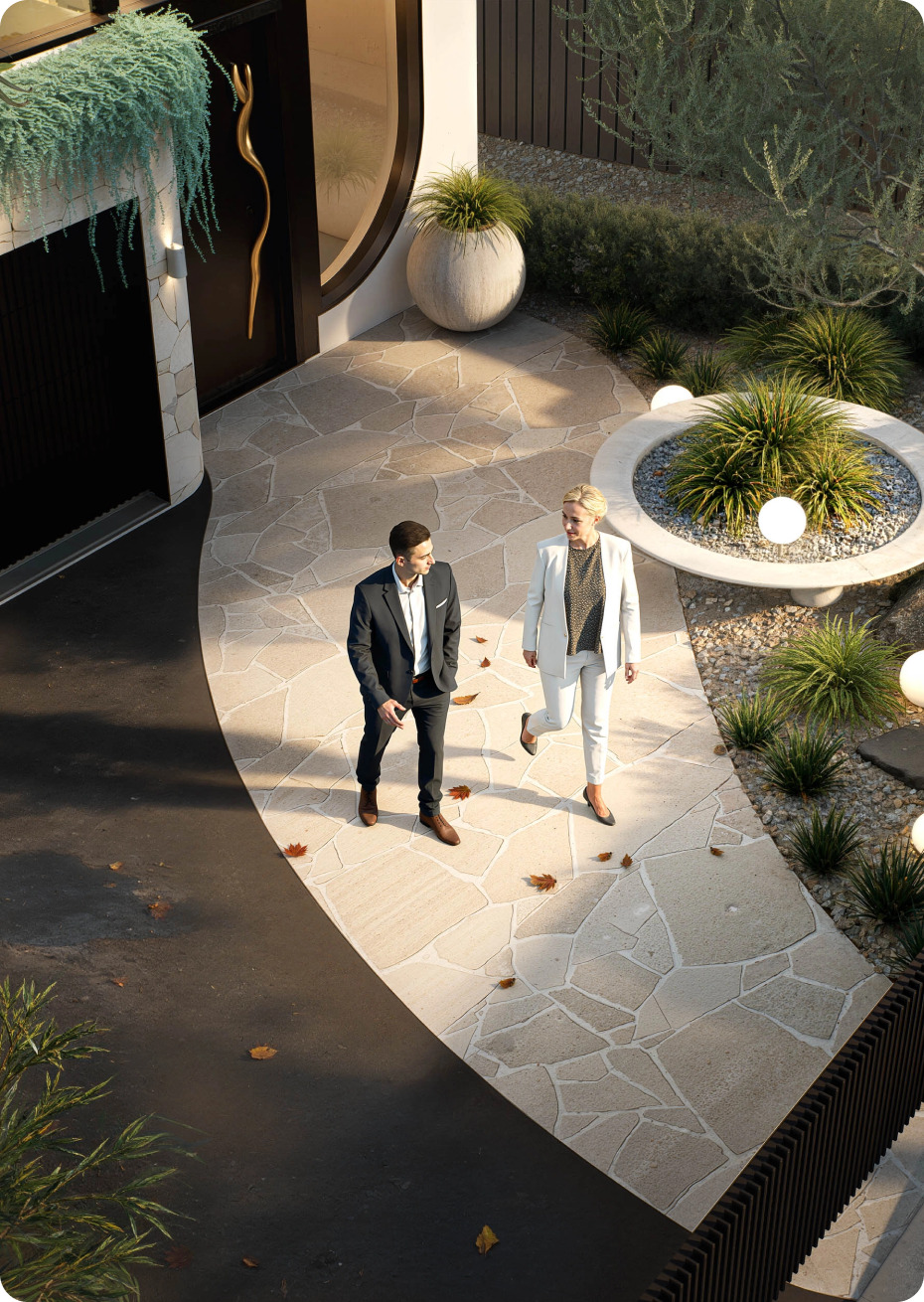 Luxury modern home facade featuring stone entry wall and landscaped courtyard at 70 Cobden Melbourne by Albert Living.