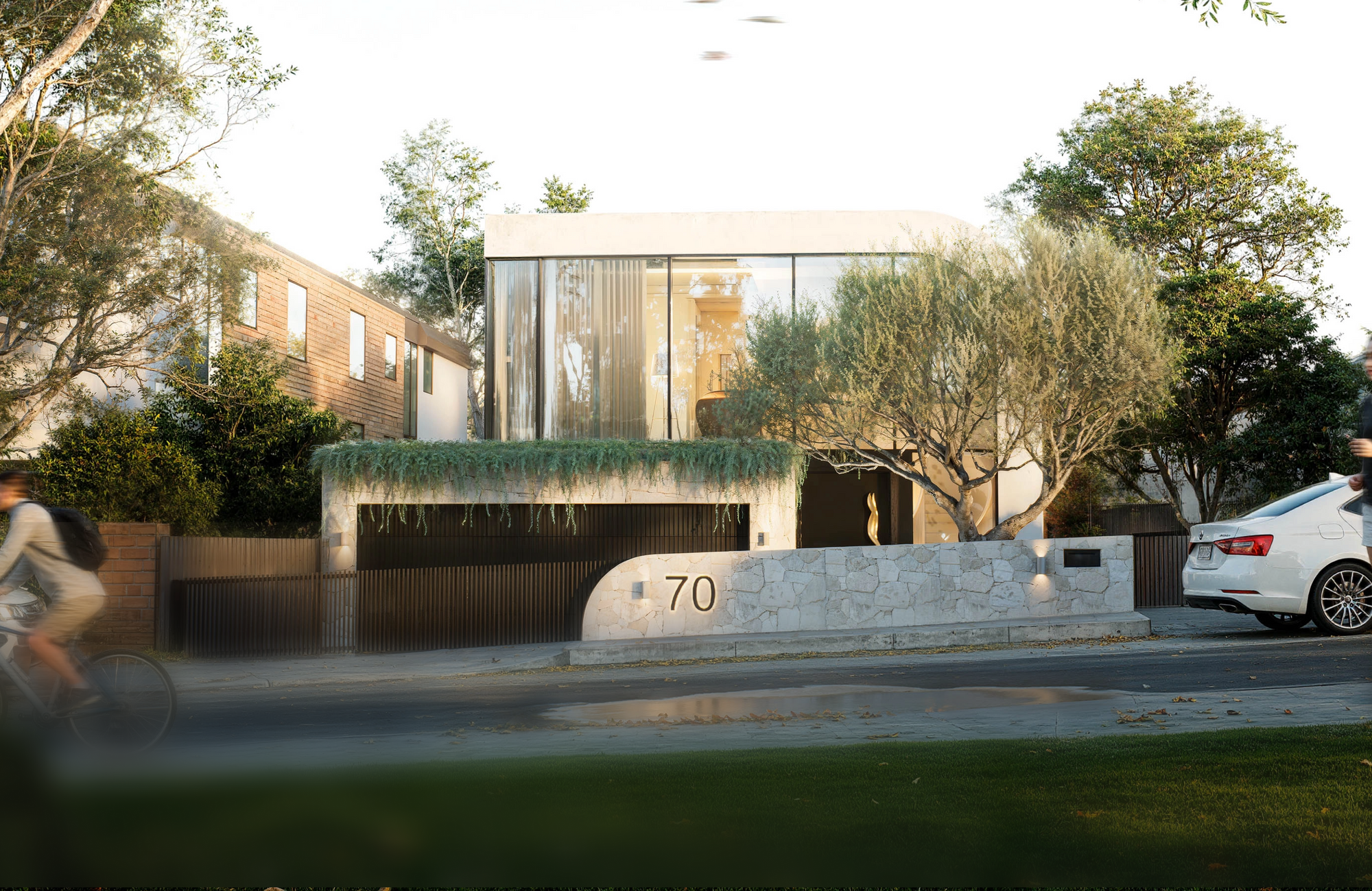 Luxury modern home facade featuring curved glazing and stone frontage at 70 Cobden Melbourne by Albert Living.