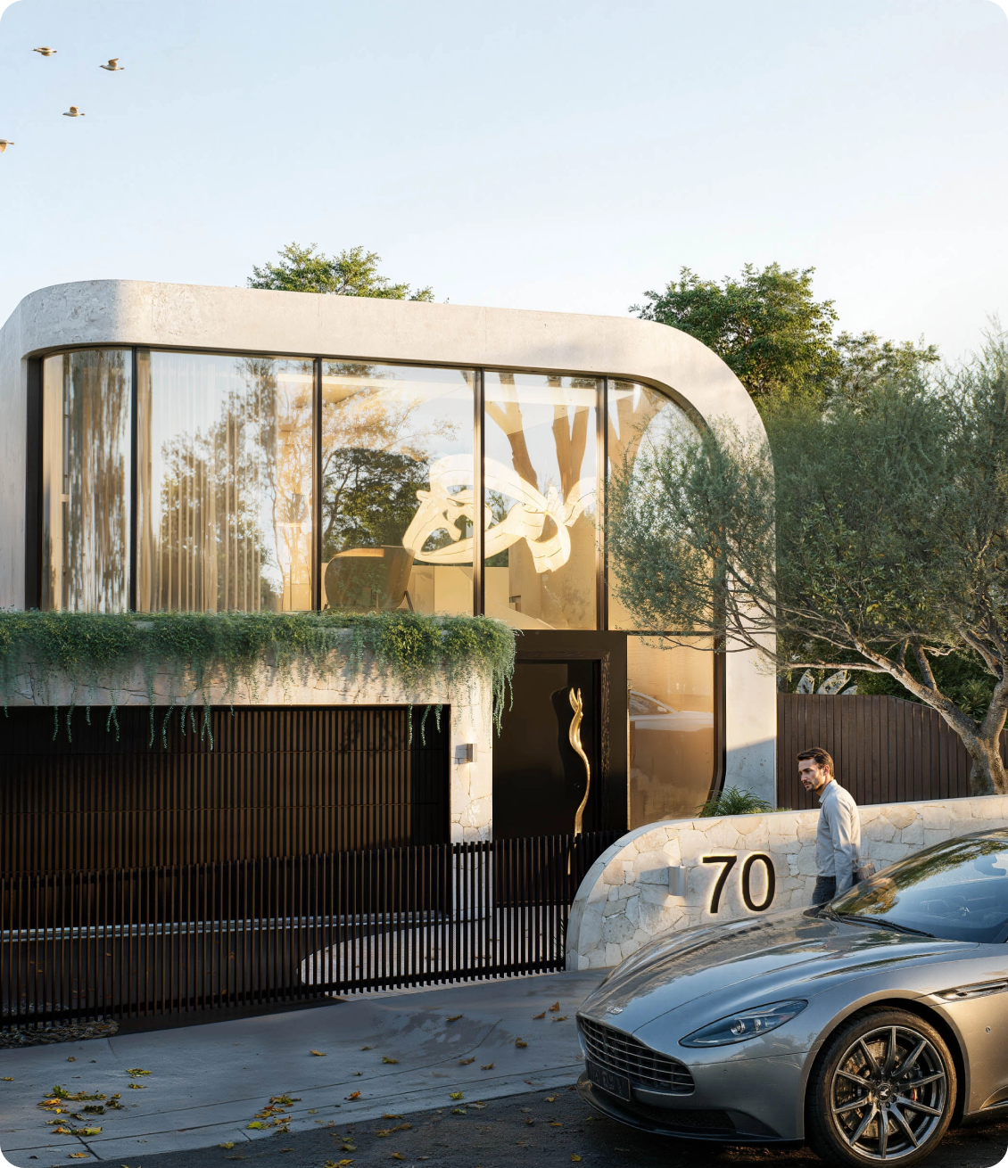 Luxury modern home facade featuring curved glass facade and integrated landscaping at 70 Cobden Melbourne by Albert Living.