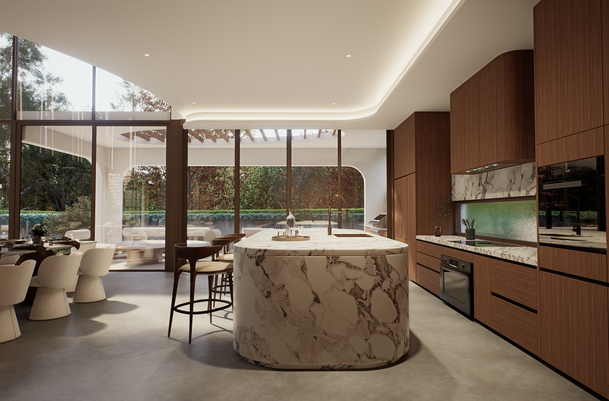 A modern kitchen interior with a large marble island in the center, wood cabinetry, built-in appliances, and floor-to-ceiling windows overlooking a patio and outdoor greenery.