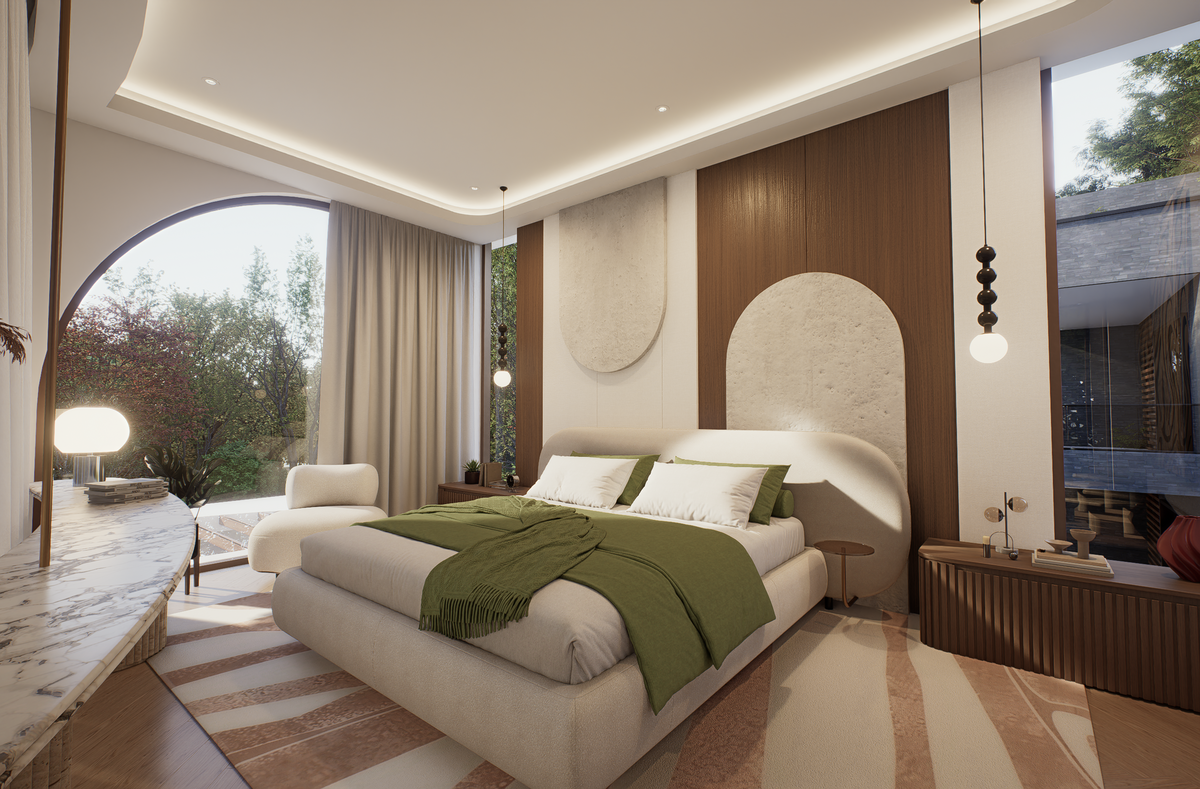 A modern bedroom interior featuring a low-profile platform bed with a light beige upholstered frame, white bedding, and a green throw blanket. The headboard area has a mix of dark wood paneling and a textured cream arch accent.